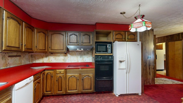 5724 E Townline Rd, Birch Run, MI 48415 - kitchen featuring black appliances, under cabinet range hood, dark colored carpet, a textured ceiling, and brown cabinetry