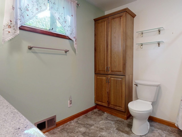 5724 E Townline Rd, Birch Run, MI 48415 - bathroom featuring toilet and baseboards