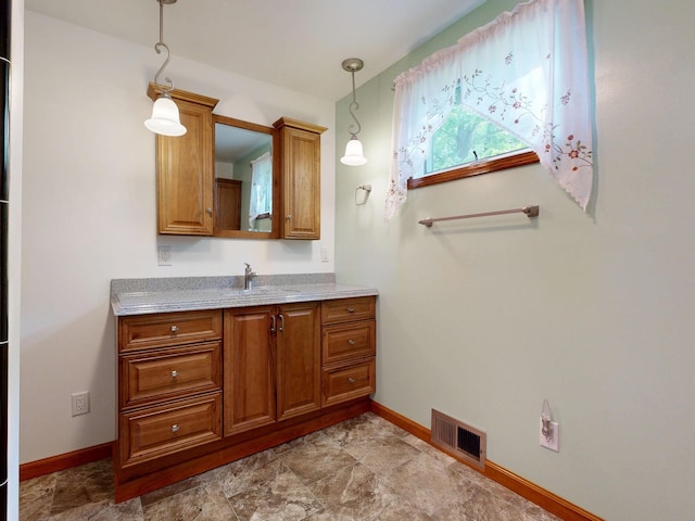 5724 E Townline Rd, Birch Run, MI 48415 - bathroom featuring baseboards and vanity