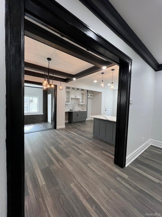 3431 Field St, Detroit, MI 48214 - unfurnished living room featuring beam ceiling, dark wood-type flooring, and a chandelier