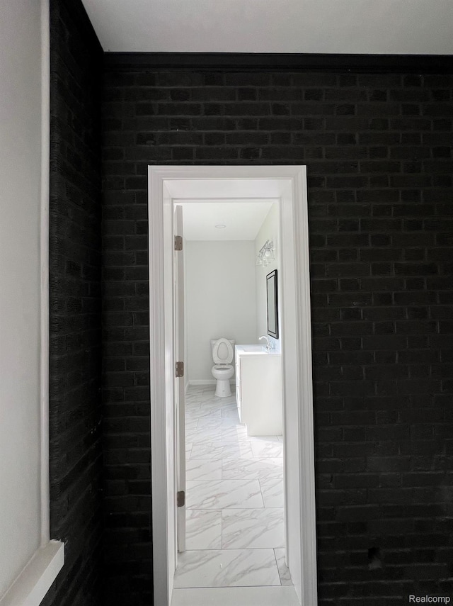 3431 Field St, Detroit, MI 48214 - hallway featuring light marble finish floors and a sink