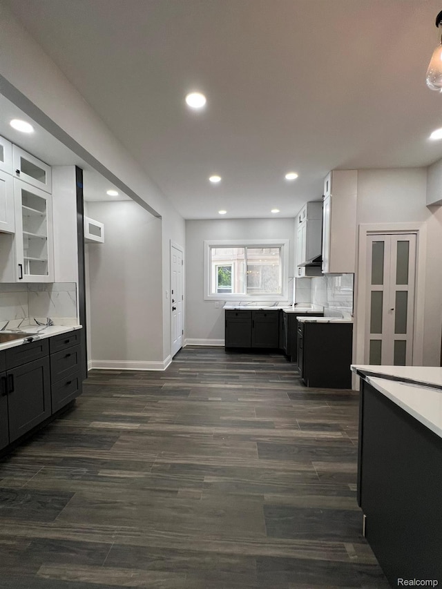 3431 Field St, Detroit, MI 48214 - kitchen with light countertops, tasteful backsplash, white cabinets, recessed lighting, and glass insert cabinets