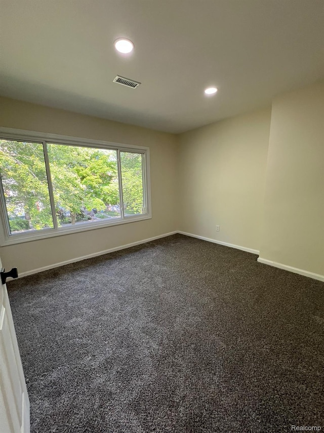 3431 Field St, Detroit, MI 48214 - spare room with dark carpet and recessed lighting