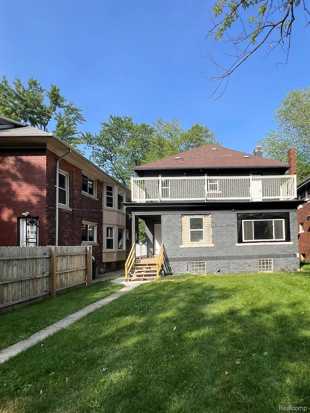 3431 Field St, Detroit, MI 48214 - rear view of house featuring a balcony and a chimney