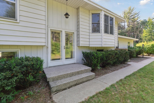 15730 Cedar Springs Ave NE, Cedar Springs, MI 49319 - property entrance featuring board and batten siding
