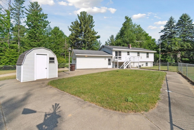 15730 Cedar Springs Ave NE, Cedar Springs, MI 49319 - view of front of property with a storage shed, a gate, and view of wooded area