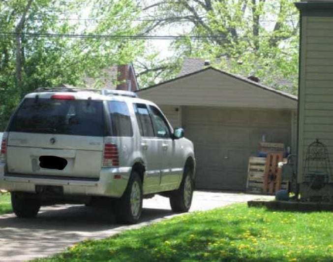 2003 Moran Ave, Lincoln Park, MI 48146 - view of vehicle parking featuring a garage