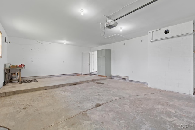 6027 Onsted Hwy, Onsted, MI 49265 - garage featuring a garage door opener