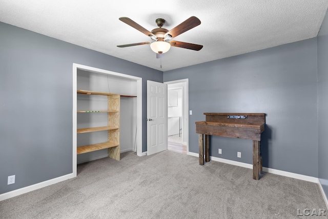 6027 Onsted Hwy, Onsted, MI 49265 - unfurnished bedroom featuring carpet floors, a ceiling fan, a closet, and a textured ceiling