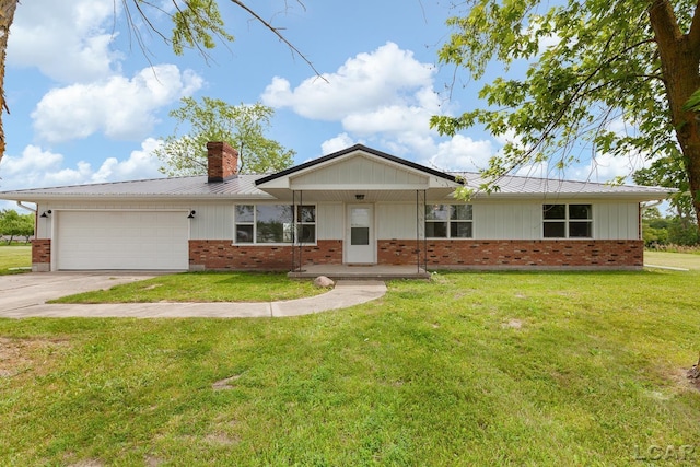 6027 Onsted Hwy, Onsted, MI 49265 - ranch-style house featuring a chimney, an attached garage, driveway, and brick siding