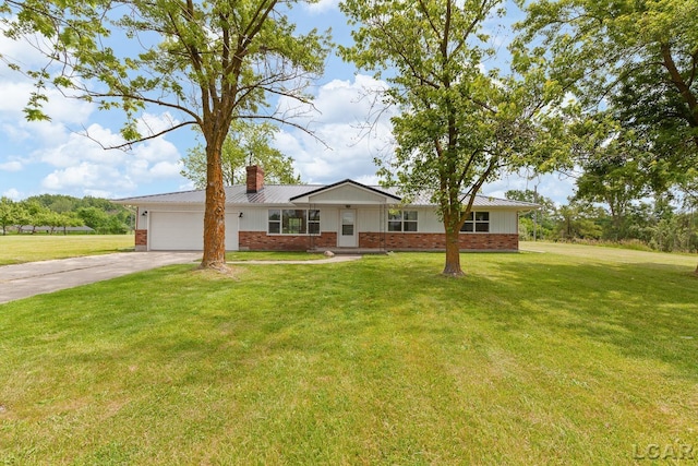 6027 Onsted Hwy, Onsted, MI 49265 - single story home featuring driveway, an attached garage, brick siding, a chimney, and a front yard