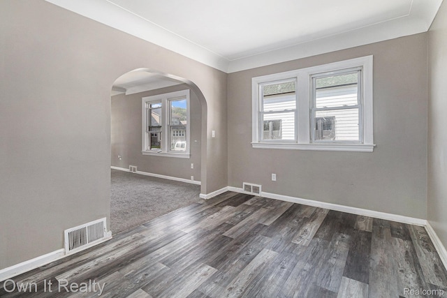 198 Fairmont St, Wyandotte, MI 48218 - unfurnished room with arched walkways and dark wood finished floors