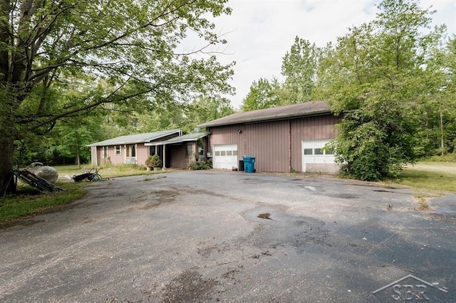 2190 S Coleman Rd, Shepherd, MI 48883 - view of home's exterior featuring asphalt driveway