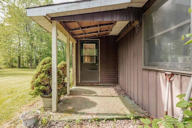 2190 S Coleman Rd, Shepherd, MI 48883 - property entrance with a lawn and board and batten siding