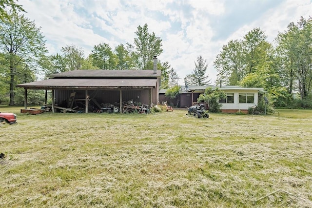 2190 S Coleman Rd, Shepherd, MI 48883 - view of grassy yard with an outbuilding