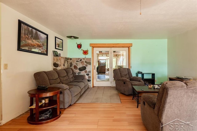 2190 S Coleman Rd, Shepherd, MI 48883 - living area featuring light wood-style flooring and french doors