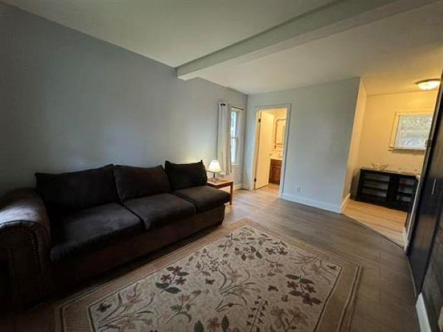 3148 Woodrow Ave, Flint, MI 48506 - living room with wood finished floors and beamed ceiling