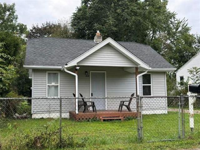 3148 Woodrow Ave, Flint, MI 48506 - bungalow-style home with a chimney and roof with shingles