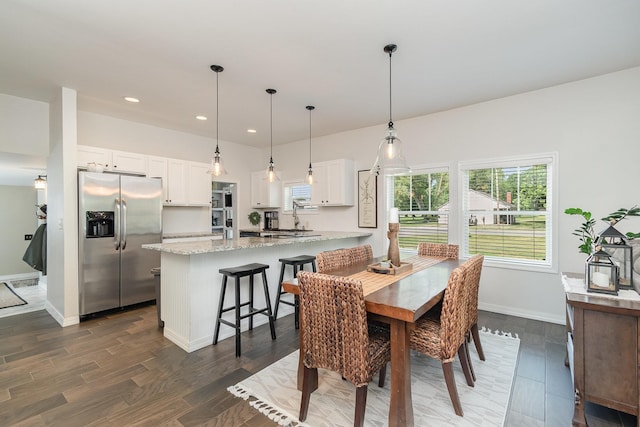 8015 Bloomer St, Carson City, MI 48811 - dining room with healthy amount of natural light, dark wood finished floors, and recessed lighting