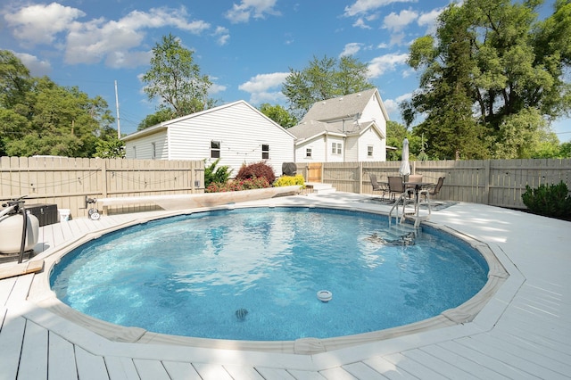 8015 Bloomer St, Carson City, MI 48811 - view of swimming pool with a fenced backyard, a patio, and outdoor dining area