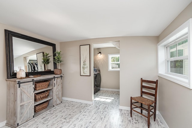 8015 Bloomer St, Carson City, MI 48811 - sitting room featuring washer / dryer and wood finished floors