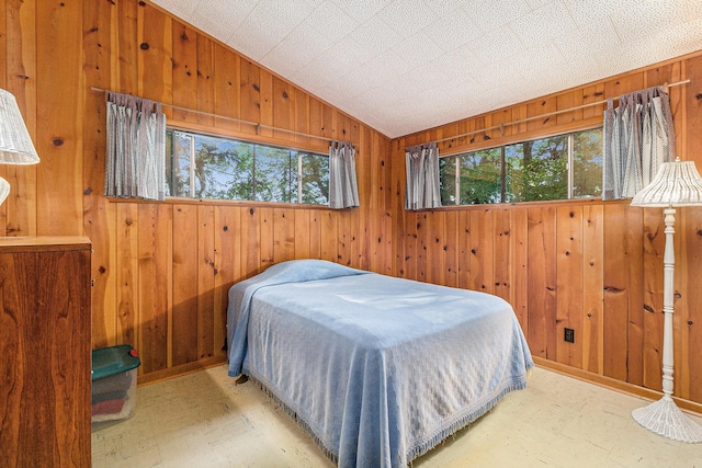 6253 Loggers Ln, Ludington, MI 49431 - bedroom with wood walls and vaulted ceiling
