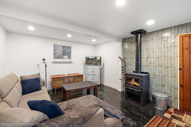 2231 N St, Milford, MI 48380 - living area featuring finished concrete floors, recessed lighting, and a wood stove