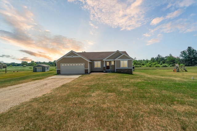 14704 Crescent Meadows Dr, Cedar Springs, MI 49319 - view of front facade with driveway, an attached garage, a front lawn, and a playground