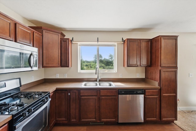 14704 Crescent Meadows Dr, Cedar Springs, MI 49319 - kitchen with appliances with stainless steel finishes and a sink