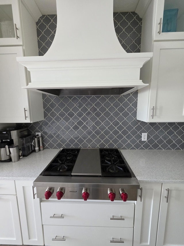 3076 Brayridge Dr, Jenison, MI 49428 - kitchen with stainless steel gas cooktop, white cabinets, and premium range hood