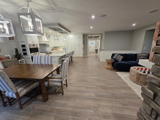 3076 Brayridge Dr, Jenison, MI 49428 - dining space featuring light wood-style flooring and recessed lighting