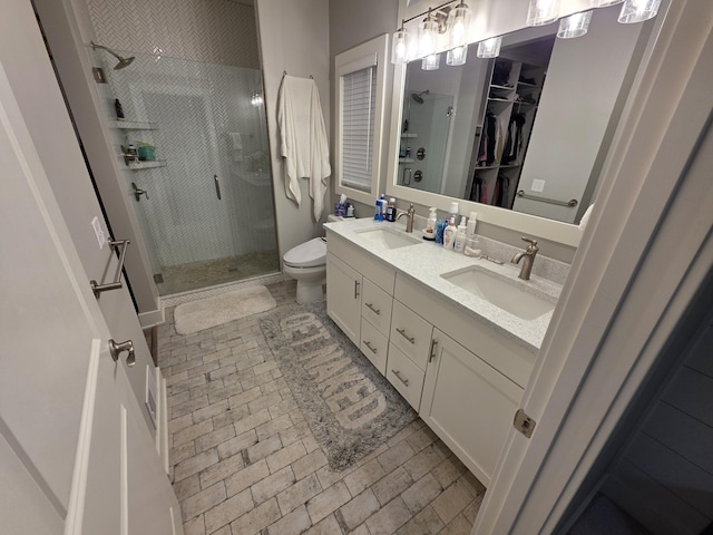 3076 Brayridge Dr, Jenison, MI 49428 - full bathroom with a shower stall, double vanity, a spacious closet, and brick patterned floors