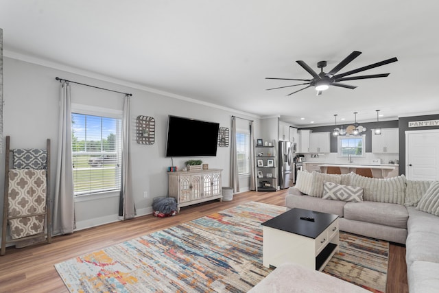 14846 Portage Rd, Vicksburg, MI 49097 - living area with ceiling fan, ornamental molding, light wood-type flooring, and recessed lighting