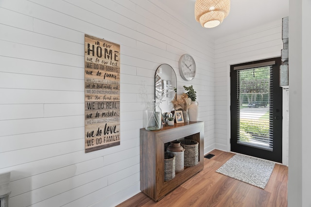 14846 Portage Rd, Vicksburg, MI 49097 - foyer entrance featuring wood finished floors and wood walls