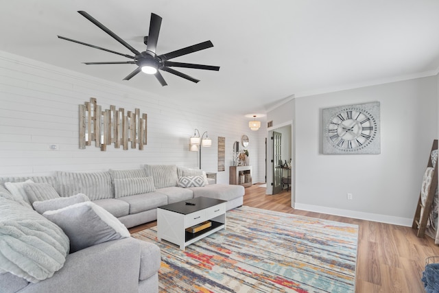 14846 Portage Rd, Vicksburg, MI 49097 - living room with wood finished floors, a ceiling fan, crown molding, and wooden walls