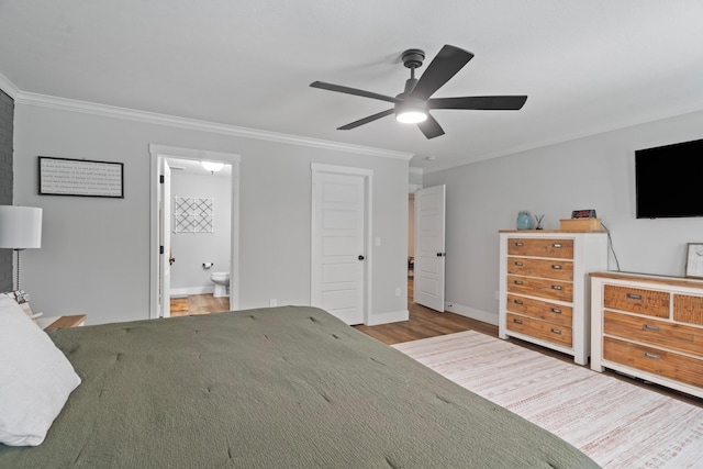 14846 Portage Rd, Vicksburg, MI 49097 - bedroom with crown molding, wood finished floors, ensuite bath, and ceiling fan