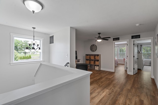 14846 Portage Rd, Vicksburg, MI 49097 - hall featuring dark wood finished floors and a chandelier