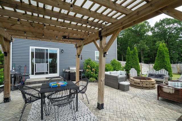 14846 Portage Rd, Vicksburg, MI 49097 - view of patio with an outdoor living space with a fire pit, a pergola, outdoor dining space, and a grill