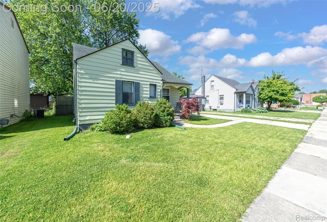 22410 Glen Ct, Saint Clair Shores, MI 48080 - bungalow with a front lawn, a shingled roof, and a residential view