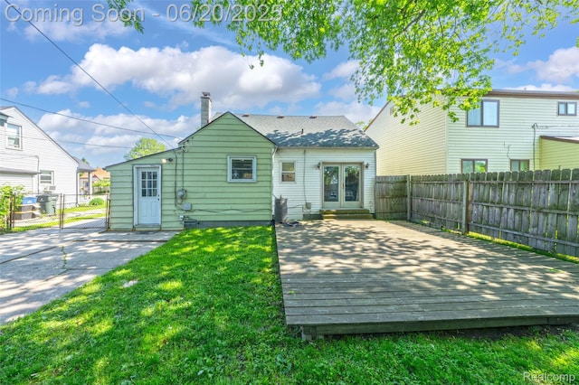 22410 Glen Ct, Saint Clair Shores, MI 48080 - back of house featuring a wooden deck, a fenced backyard, and a chimney