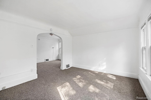 5261 Lakeview St, Detroit, MI 48213 - empty room with arched walkways and carpet