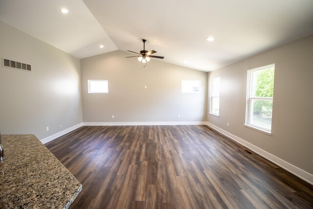 11449 Hidden Oaks Dr, Clio, MI 48420 - unfurnished living room with a ceiling fan, dark wood-style floors, lofted ceiling, and recessed lighting