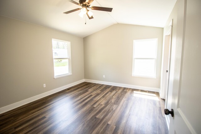 11449 Hidden Oaks Dr, Clio, MI 48420 - spare room featuring ceiling fan, vaulted ceiling, and dark wood-style flooring