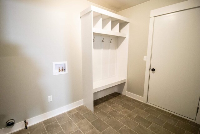 11449 Hidden Oaks Dr, Clio, MI 48420 - mudroom with baseboards and dark tile patterned flooring