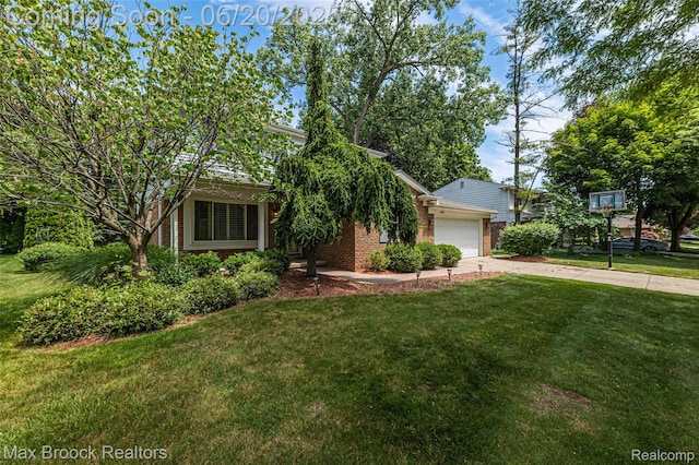 683 Thurber Dr, Troy, MI 48085 - view of property hidden behind natural elements with brick siding, driveway, a front lawn, and an attached garage