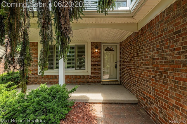 683 Thurber Dr, Troy, MI 48085 - view of exterior entry with brick siding and covered porch