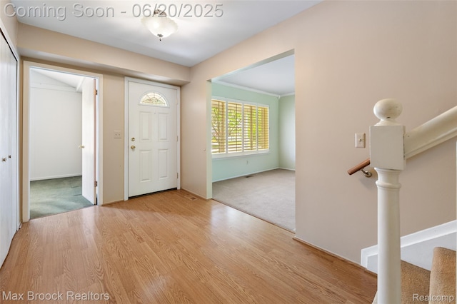 683 Thurber Dr, Troy, MI 48085 - carpeted foyer with wood finished floors