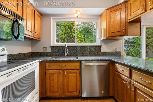 683 Thurber Dr, Troy, MI 48085 - kitchen with white range with electric cooktop, dishwasher, brown cabinets, and healthy amount of natural light