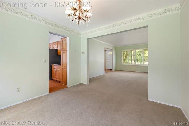 683 Thurber Dr, Troy, MI 48085 - spare room with light carpet, a chandelier, and crown molding