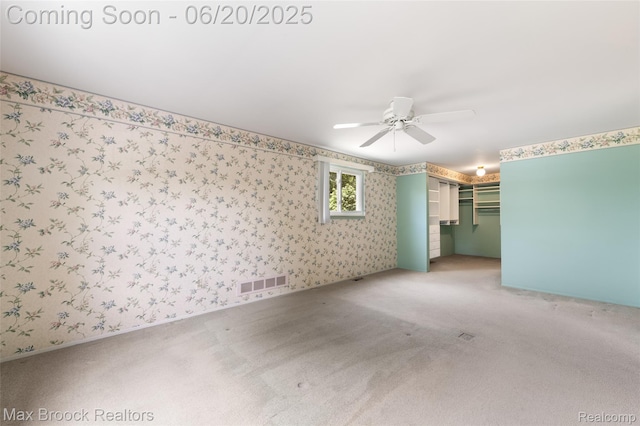 683 Thurber Dr, Troy, MI 48085 - empty room with a ceiling fan, carpet flooring, and wallpapered walls